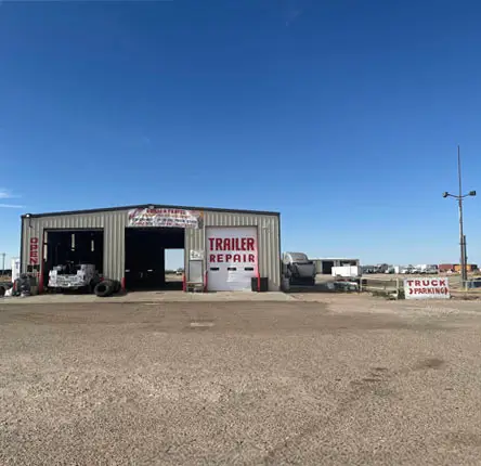 Long distance shot of a truck and trailer repair repair shop.